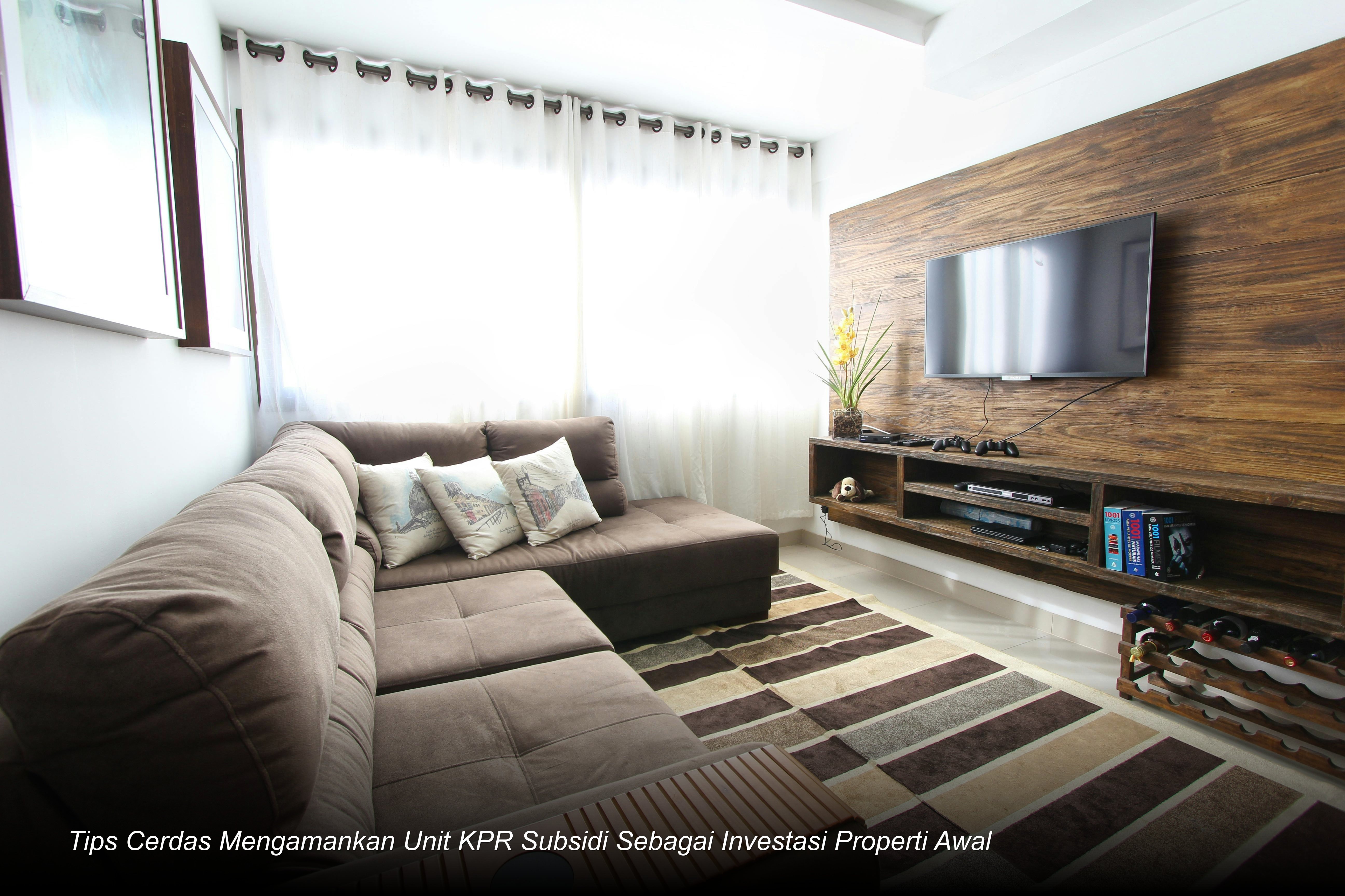 Sebuah deretan rumah minimalis modern dengan desain fasad elegan dan taman depan yang asri di kawasan perumahan subsidi yang tertata rapi.